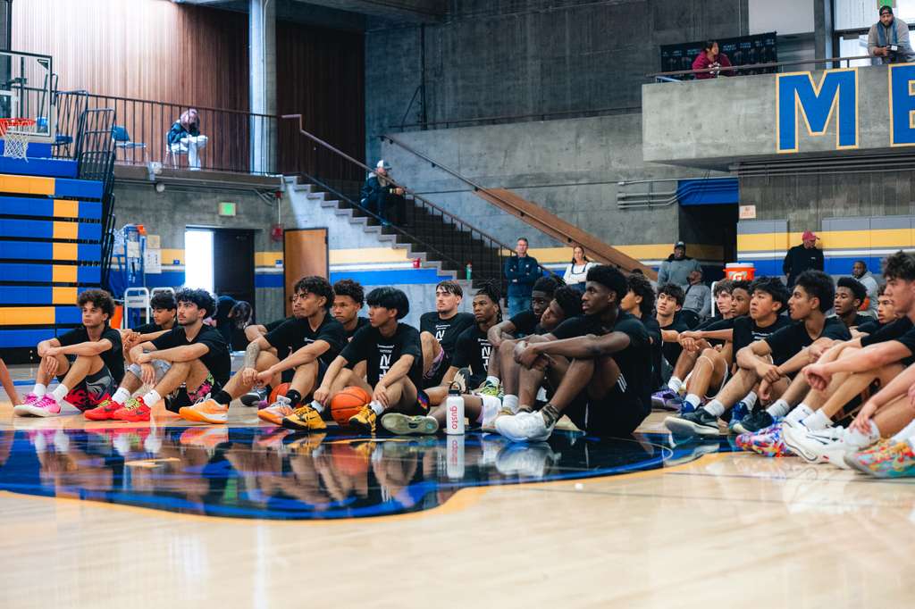 National NIL Sports athletes courtside at a community event